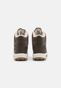 Brown suede ankle boots with a soft cream lining, featuring a rugged white outsole and subtle stitching details on the sides.
