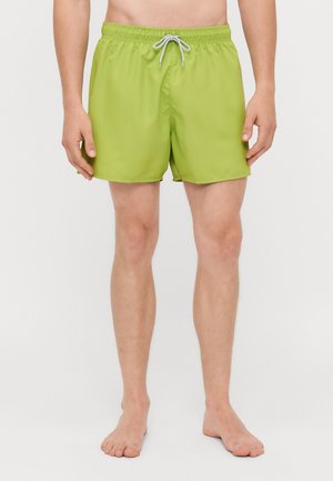 Groene zwembroek met een elastische tailleband en een grijze trekkoord, met een eenvoudige, gladde structuur en een klassiek ontwerp tot halverwege de bovenbenen.