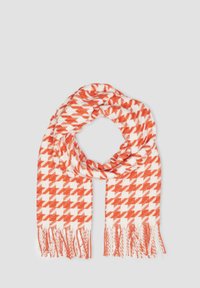 Woven scarf in white with alternating orange houndstooth pattern. Features fringed edges, soft texture, lightweight, and rectangular shape.