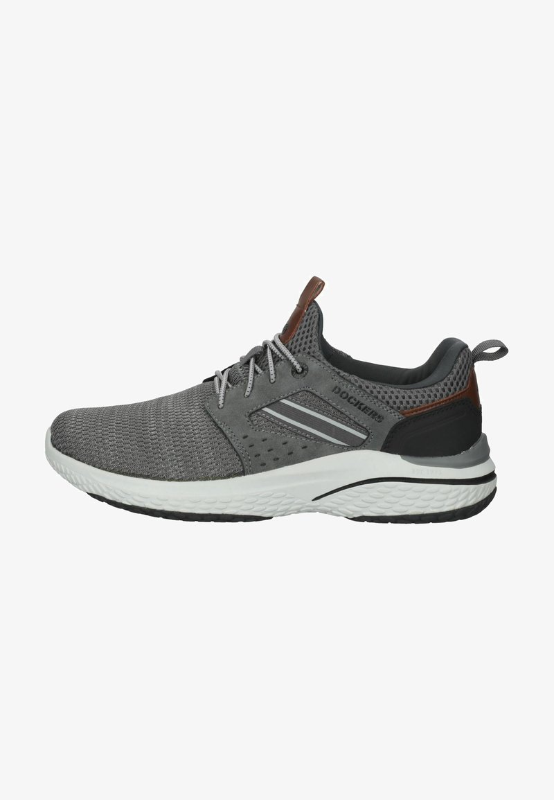 Gray mesh sneaker features a white sole, black accents, and brown leather detailing. Includes grey laces and subtle side stripes.