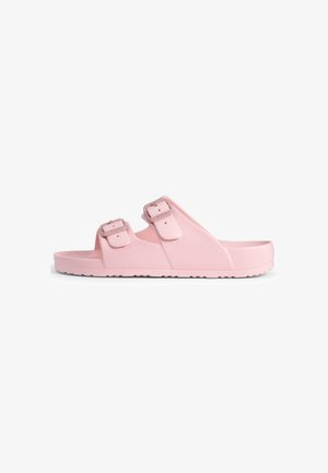 Rosa Gummisandalen mit zwei verstellbaren Riemen mit Schnallen, flacher Sohle und einem strukturierten Profil für besseren Halt.