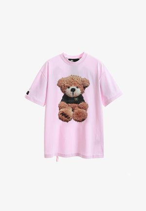 Camiseta de algodón rosa con un gráfico texturizado de un oso de peluche en marrón y negro. Manga corta y un corte relajado.