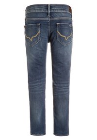 Tmavě modré džíny z denimu se zúženým střihem, s mírně zvýšeným pasem, zadními kapsami se žlutým prošíváním a čistým lemem.