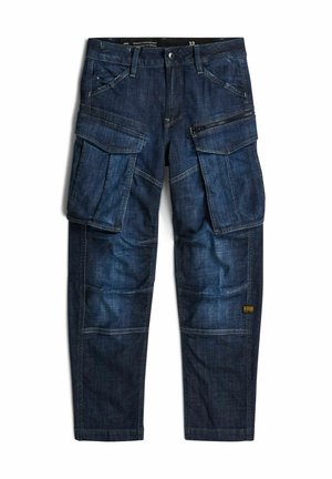 Ciemnoniebieskie spodnie typu cargo z denimu z wieloma dużymi kieszeniami, w tym zamkami błyskawicznymi i patkami oraz zapinanym na guziki pasem.