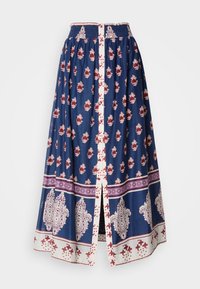 Jupe longue en coton bleu marine avec des motifs floraux rouges, accents blancs, taille élastique et une fente à l'avant. Designs de bordureintriqués dans des couleurs contrastées.