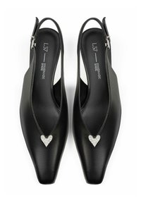 Black leather slingback shoes featuring a pointed toe, decorative heart-shaped embellishment with rhinestones, and adjustable ankle strap.