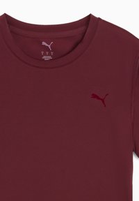 Bordo Puma majica s okruglim izrezom i Puma logom na lijevoj strani prsnog koša, veličina mala, napravljena u Vijetnamu.