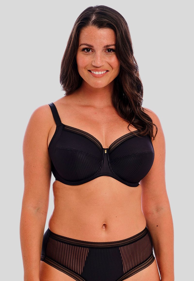 Black bra with underwire, vertical striped texture, lace trim along the edges, and a gold accent in the center. Matching high-waist underwear.