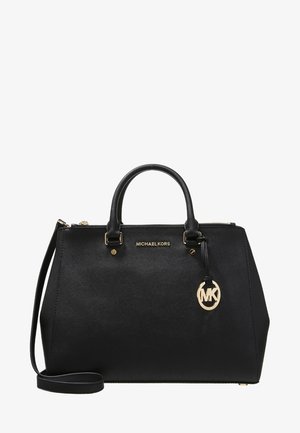 Czarna torebka Michael Kors z podwójnymi rączkami, odpinanym paskiem na ramię, złotym logo i złotym zamkiem błyskawicznym.