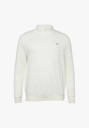 Biały pulower z długim rękawem, z suwakiem sięgającym do ćwiartki długości oraz małą, prostokątną naszywką z logo na lewej piersi.