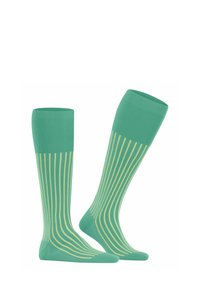 Calze fino al ginocchio di colore verde menta con strisce verticali di un verde chiaro. Realizzate in un materiale liscio e elastico per garantire comfort.