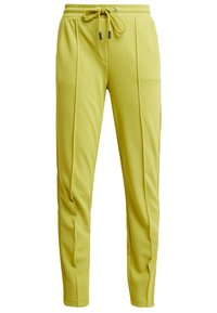 Yellow jogger pants made of soft fabric, featuring an elastic waistband with adjustable drawstring and side pockets, tapered design, and stitched details.