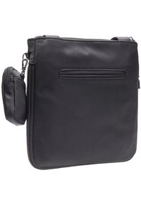 Borsa a spalla nera in nylon resistente, dotata di chiusura con zip, tasca esterna a scomparsa e ulteriore piccola pochette con zip attaccata.