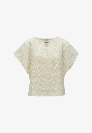 Blouse blanche en dentelle manches courtes avec motifs floraux, col rond et petit fermoir en perles de bois à l'ouverture en forme de goutte à l'avant.