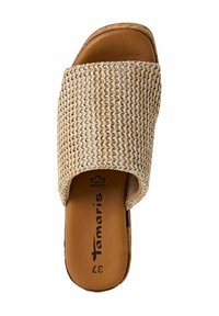 Sandali scivolati beige intrecciati con una parte superiore testurizzata e una soletta in pelle liscia. Presentano una suola piatta e un design semplice e minimalista.