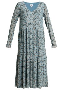 Sukienka z długim rękawem i dekoltem w kształcie litery V w jasnoniebieskim materiale z kwiatowym wzorem w kolorze czarnym i brązowym. Posiada warstwowy krój i luźny fason.
