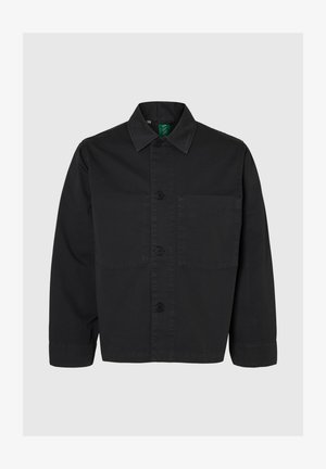 Črna bombažna jakna s srajčnim zapenjanjem, z ovratnikom z vrhovi, dolgimi rokavi, prsnim žepom in ravnim robom. Gladek tekstura.