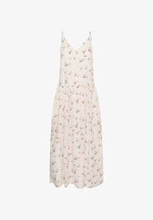 Vestito midi bianco senza maniche con sottili spalline e piccolo motivo floreale rosa e giallo su tutta la superficie.