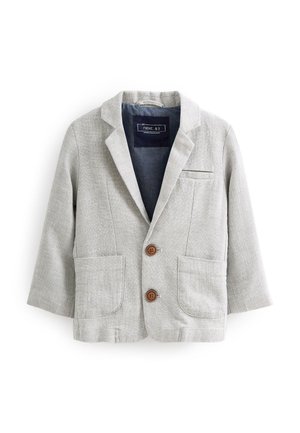 Blazer gris clair en tissu texturé, avec col à revers, deux poches avant et fermeture à boutons marron. Intérieur doublé en tissu foncé.