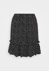 Jupe noire à imprimé floral blanc, dotée d'une taille élastique, d'un ourlet volanté et de petits nœuds sur les côtés.