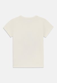 Kortärmad, krämfärgad t-shirt i bomull med rundad halsringning och en slät textur. Enkel, enfärgad design utan mönster.
