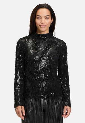 Zwarte lang-sleeve top met een textuurdesign met glanzende draden. Hoge hals en aangesloten silhouet. Ontworpen met accenten van pailletten.