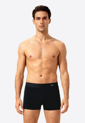 Zwarte boxershorts voor mannen, gemaakt van gladde stof, met een brede elastische tailleband en een strakke pasvorm voor ondersteuning. Geen zichtbare patronen of logo's.