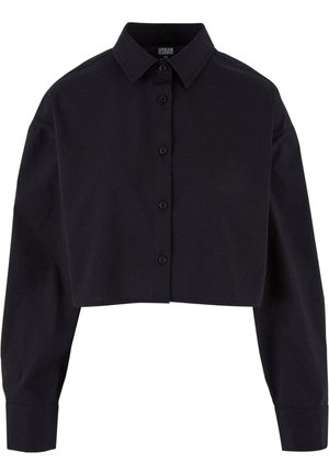 Chemise noire en coton, coupée, à manches longues, avec un col classique et un ourlet droit.