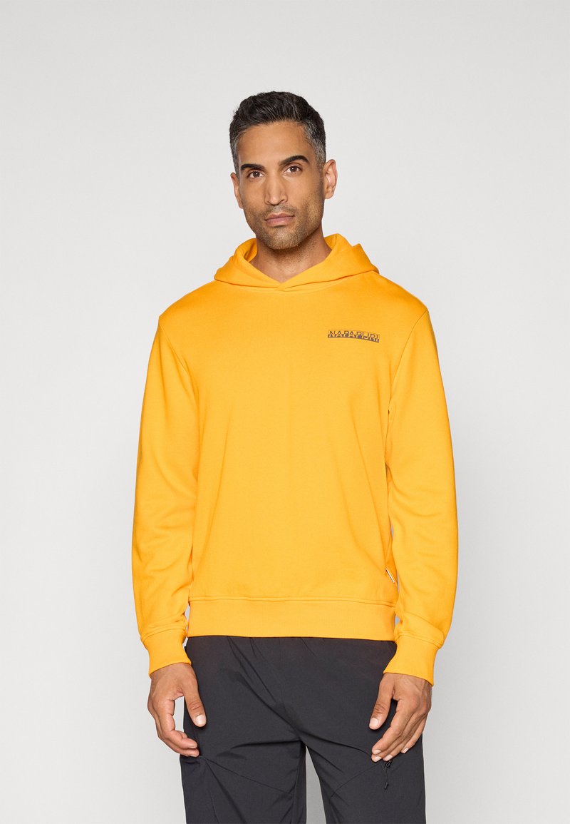 Gelbes Kapuzensweatshirt mit Kängurutasche. Weicher Stoff, gerippte Bündchen und Saum. Logo in dunklerem Farbton auf der linken Brust.