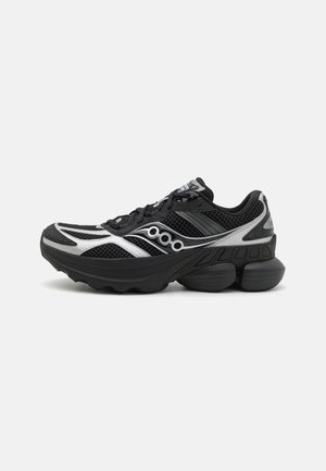 Mesh black running shoe with silver accents, rounded toe, cushioned sole, and patterned design on the sides. Features laces and a padded collar.