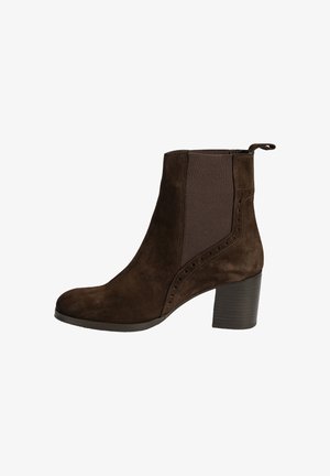 Brown suede ankle boot with elastic side panels, contrasting brown texture, a rounded toe, and a chunky heel. Accented with small perforations.