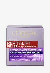 Boîte violette pour L'Oréal Revitalift Filler avec du texte doré et blanc. Contient des informations sur l'acide hyaluronique et les propriétés anti-âge.