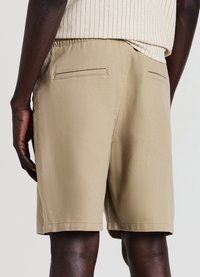 Calliope BIG JOGGER - Jogginghose - beige scuro