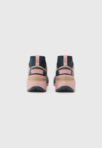 High-top sneakers featuring a navy upper, beige panels, pink accents, and textured soles. Durable material with pull tabs for easy wear.