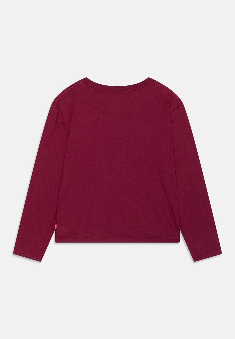 Langärmliges, runderhalsige Shirt aus tiefburgunderfarbenem Baumwollstoff. Einfaches Design mit lockerer Passform. Sichtbare Nähte am Saum und an den Bündchen.