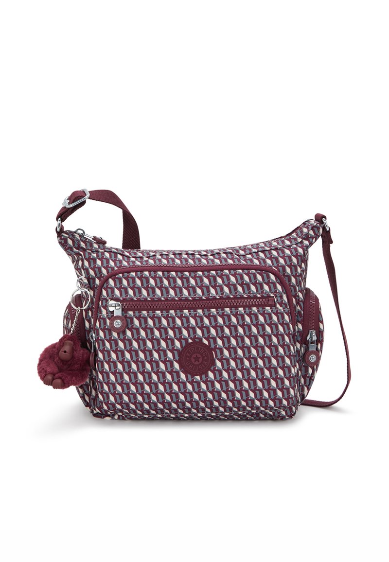 Schultertasche aus burgunderfarbenem, gemustertem Stoff mit strukturiertem Finish. Besitzt mehrere Reißverschlusstaschen und einen Pompon-Anhänger an der Seite.
