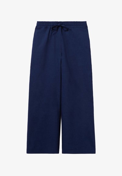 Pantalons larges en lin de couleur marine, dotés d'une taille élastique avec cordon de serrage, de poches latérales et d'une texture douce.