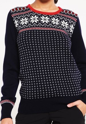 Granatowy sweter z białym i czerwonym wzorzastym splotem, z motywami płatków śniegu i geometrycznymi wzorami na przodzie i mankietach.
