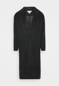 Cappotto lungo in lana nera con due tasche applicate frontali, due bottoni, colletto con revers a incavo e lunghezza media, mostrato su sfondo bianco.