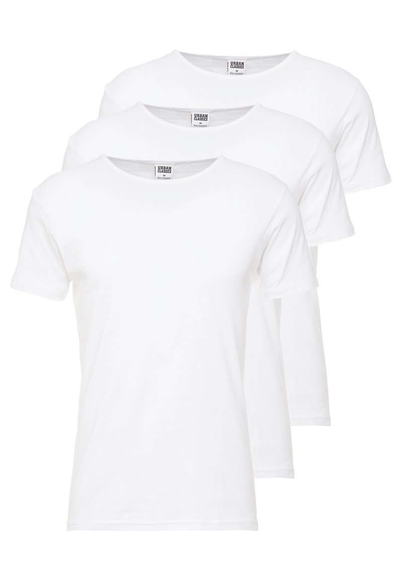 Trois T-shirts blancs à manches courtes disposés en pile. Fabriqués en coton, ils ont un col rond et une coupe régulière.