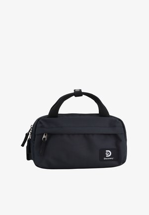 Black nylon bag with a rectangular shape, double top handles, zip closure, and a front pocket featuring a logo patch. Smooth texture.