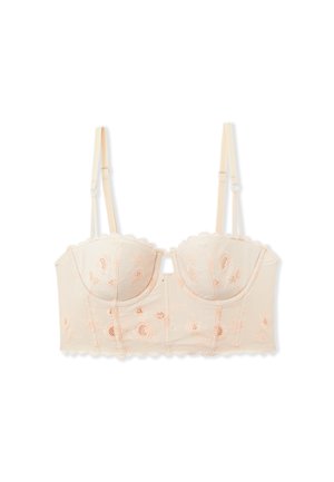Lace bralette in light nude with peach floral embroidery, structured cups, and scalloped edges. Adjustable straps and hook closure at back.
