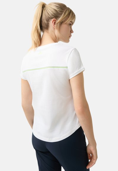 White cotton t-shirt with short sleeves, featuring a narrow green accent stripe across the upper back and a rounded hem.