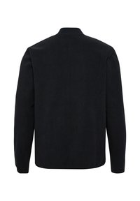 Black fleece jacket with a minimalistic design, featuring a ribbed collar and long sleeves. The fabric has a soft, textured finish.