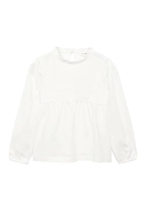 Blouse blanche à manches longues en tissu doux, avec un col haut, des détails smockés sur la poitrine et des poignets élastiqués.