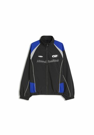 Black zip-up jacket with blue and gray panels, elastic cuffs and hem, and white text reading "Altered Realities" on the chest.
