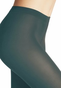 Leggings verde scuro realizzati in materiale elastico, caratterizzati da una superficie liscia e una cintura ampia. Il design è aderente senza cuciture visibili.