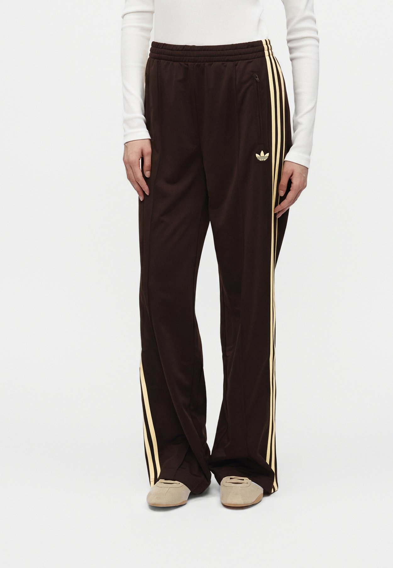 adidas FIREBIRD LOOSE - Tracksuit bottoms - aurora coffee/almost yellow