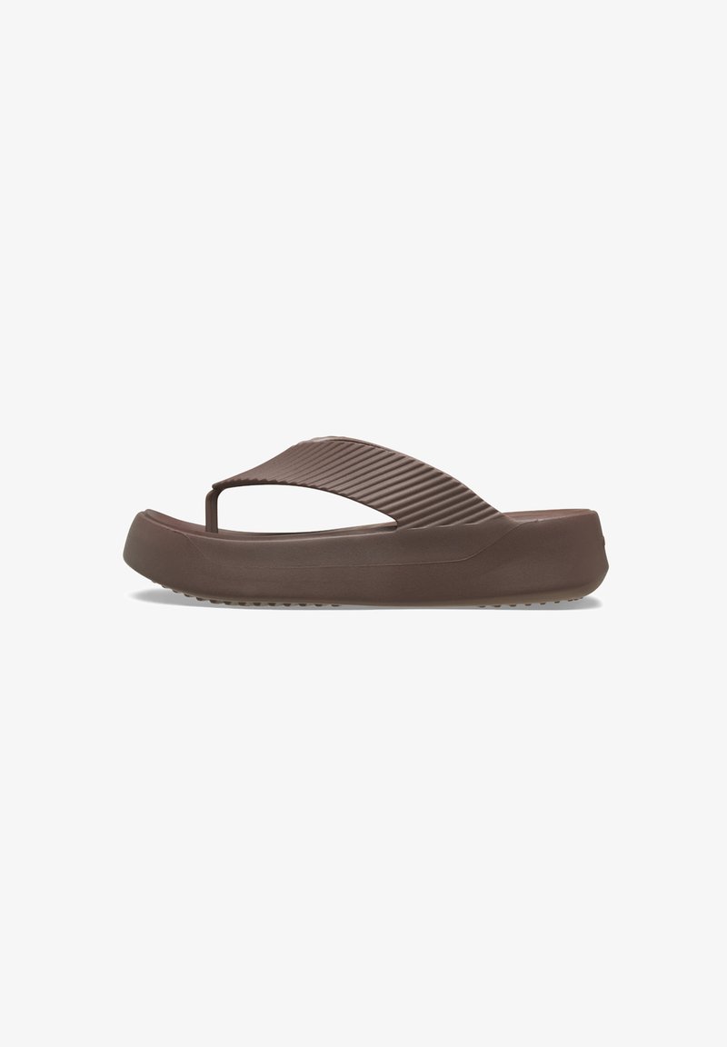 Brown flip-flop sandal with a textured strap and a thick sole. The strap features vertical grooves and a rounded toe post design.
