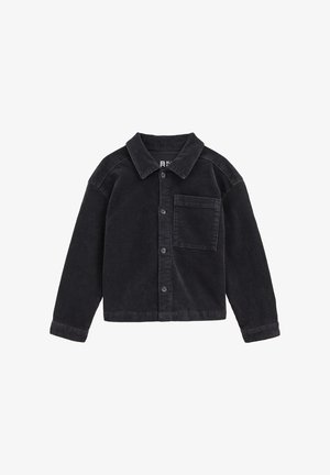 Camicia nera in corduroy con bottoni e colletto, dotata di una tasca frontale e di un tessuto texturizzato. Maniche lunghe con polsini a bottone.